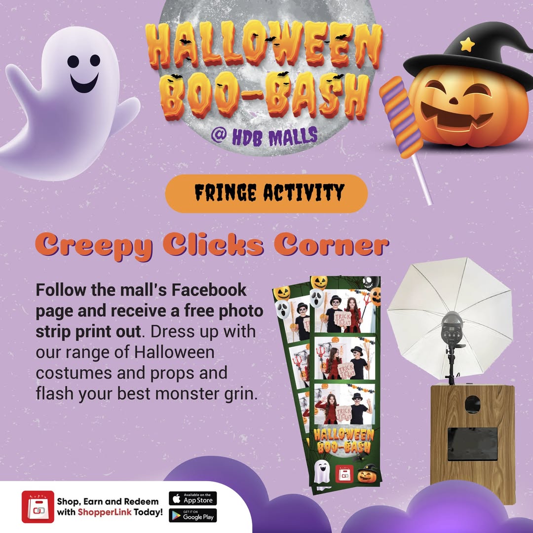 A vibrant Halloween-themed photo booth setup with various spooky and fun props, inviting visitors to take pictures.