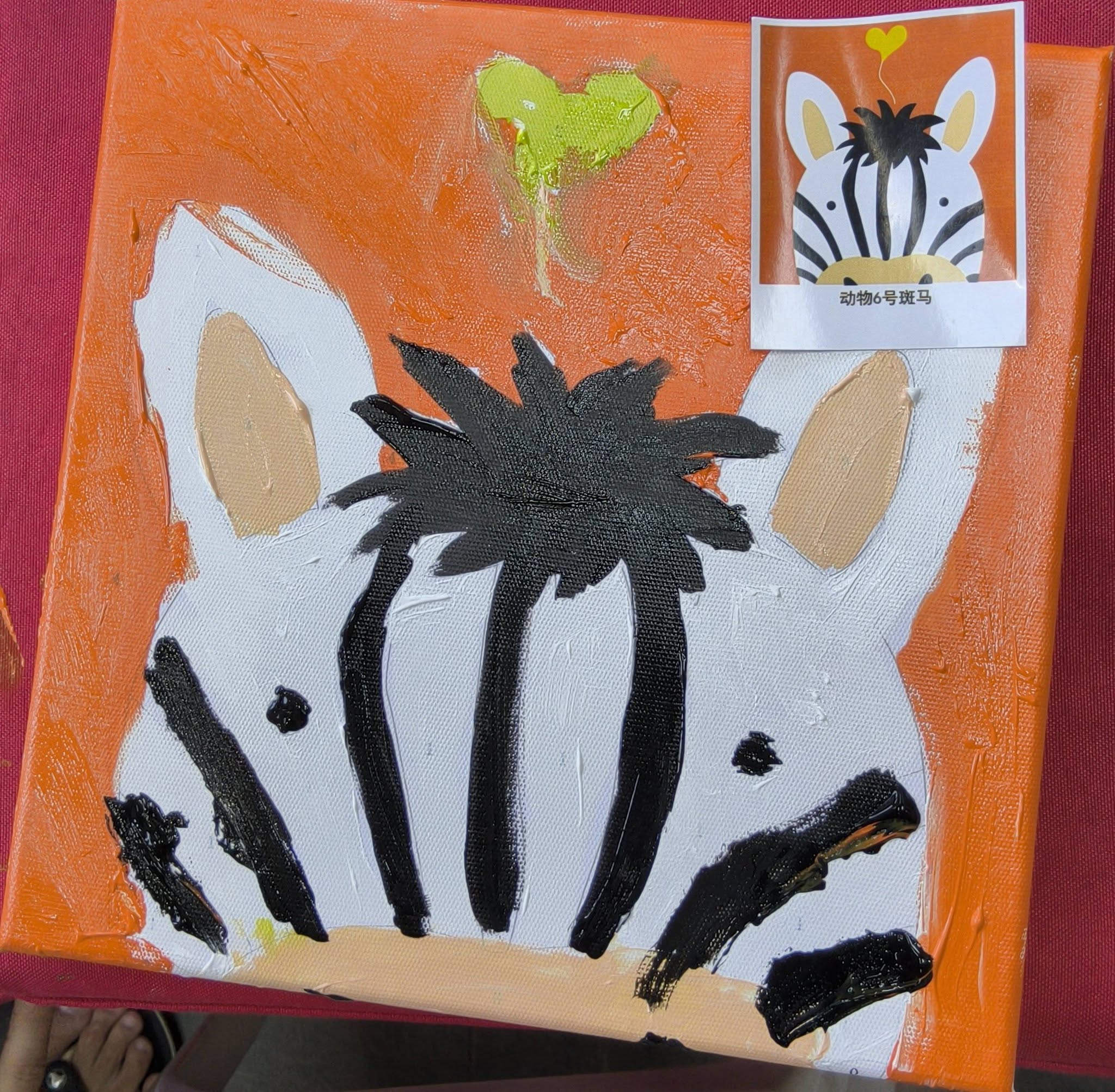 Child's zebra painting on orange background with Animal No. 6 card