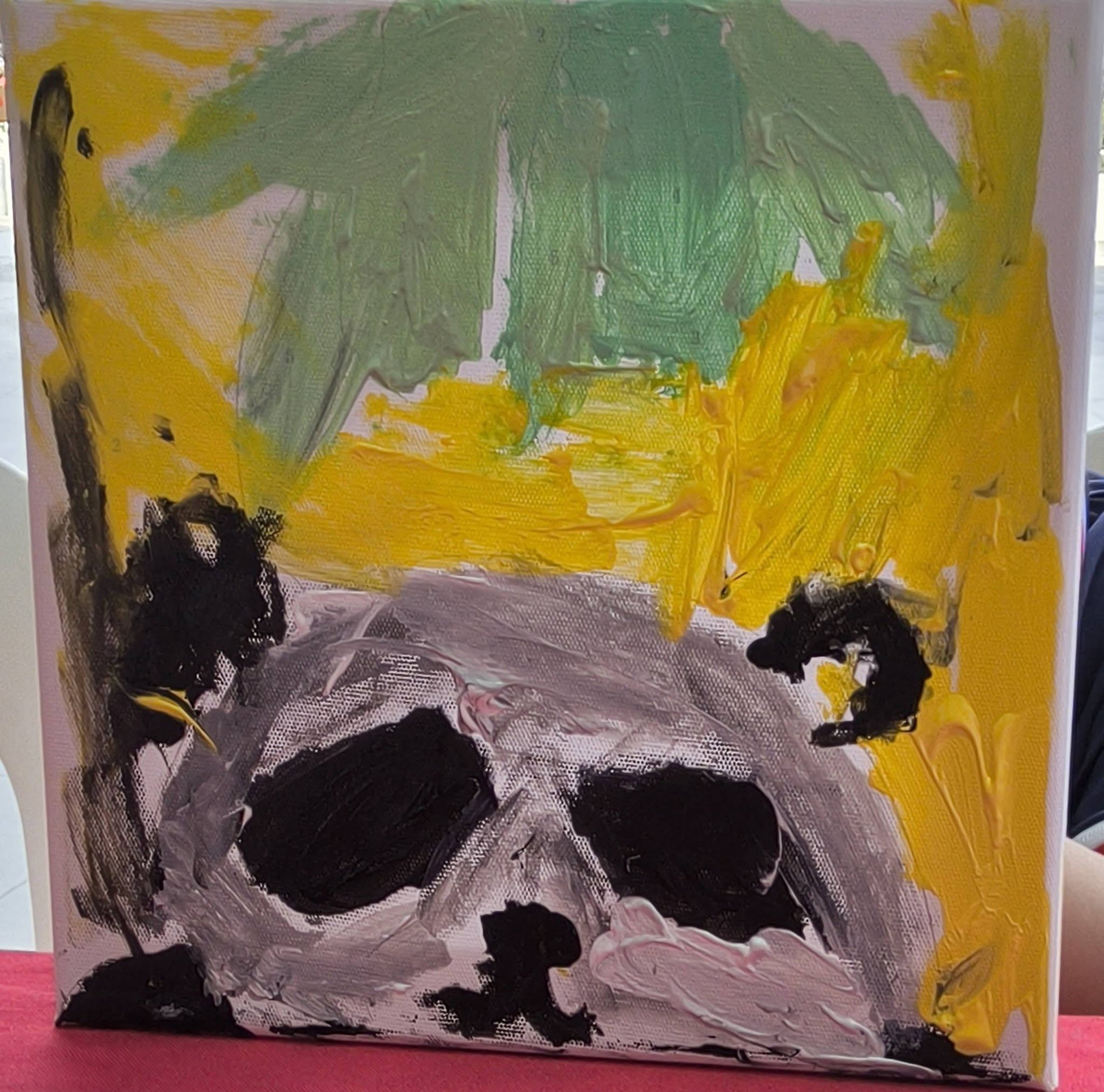 Abstract canvas with bold yellow, green, black and white brushstrokes from Play and Unite at Canberra Plaza