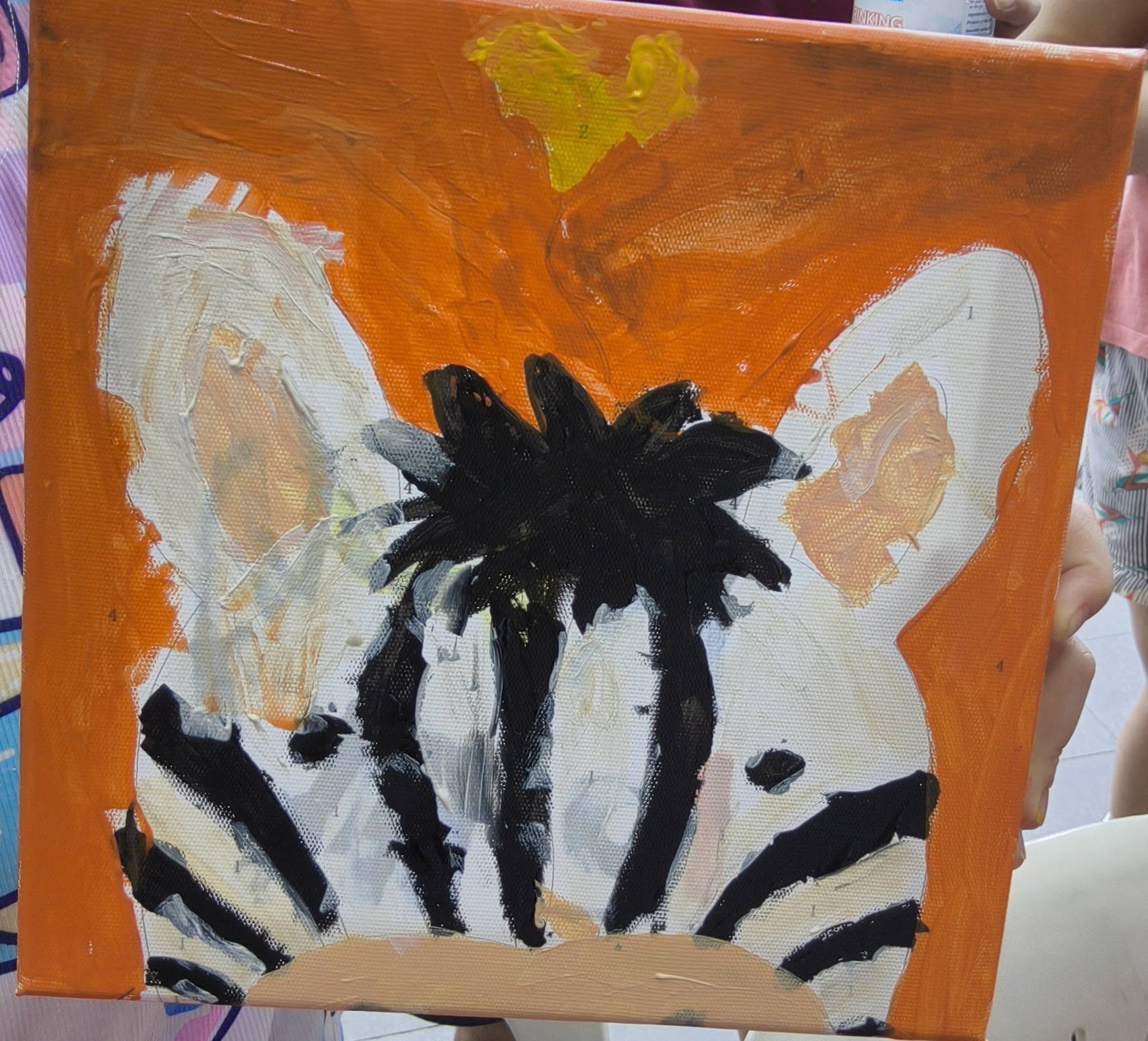Small abstract black and white canvas painting on orange background